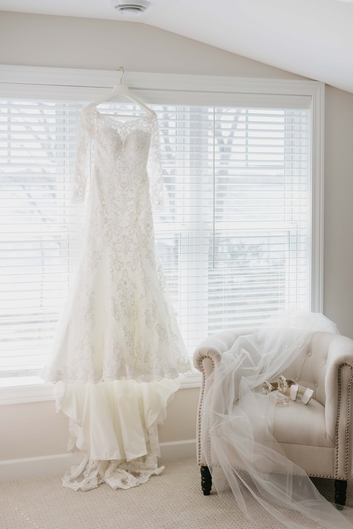 lace wedding dress staged in window