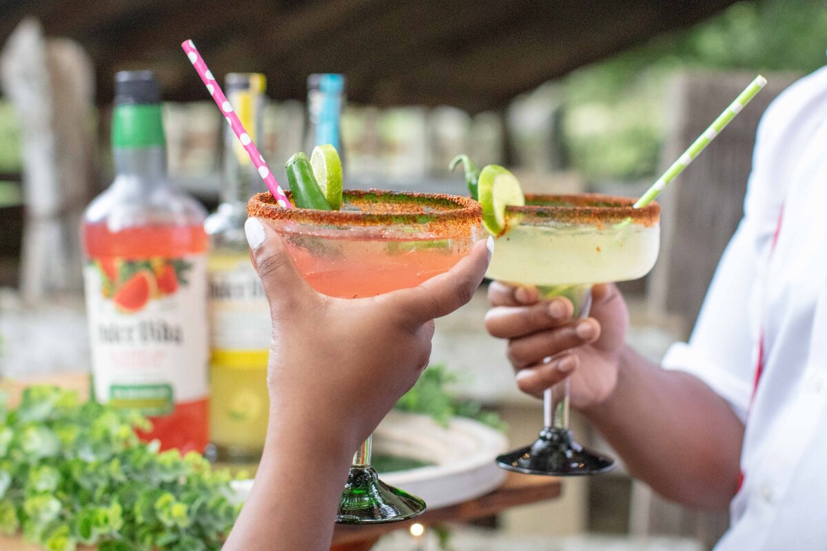 cheers with margaritas served at Texas wedding