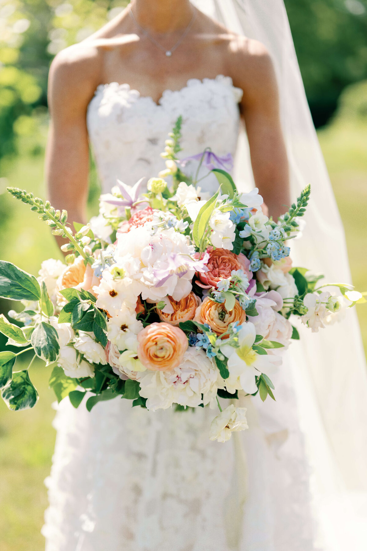 Bride holding colorful bouquet
