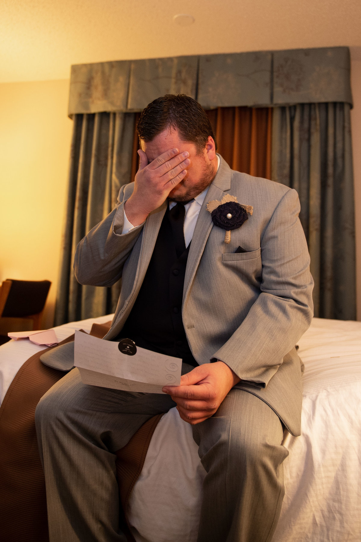 groom reads letter from bride before ceremony