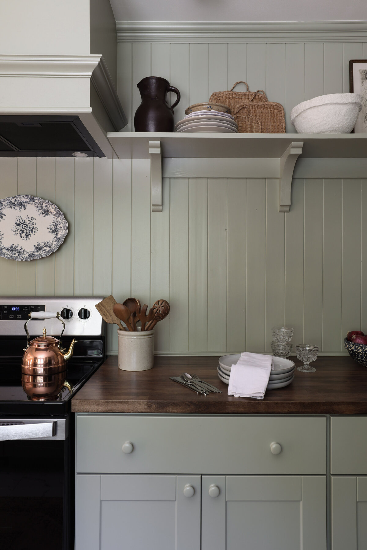 Moody Rustic Laundry Room renovation by Nadine Stay | Dark wood stained walls. Brown painted doors. DIY Ikea Pax hack. DIY mudroom built in cabinet. DIY shaker cabinet doors. DIY inset drawers. Basketweave brick floors.