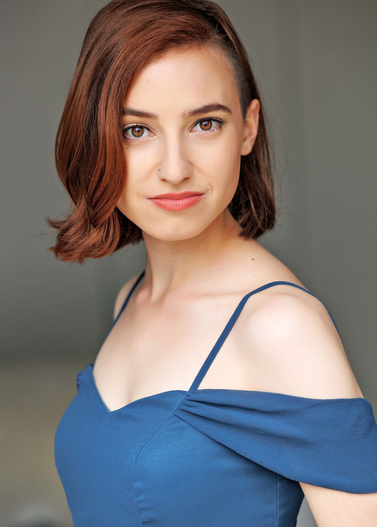 A girl in a blue green dress during an actor headshot session in the Bay Area