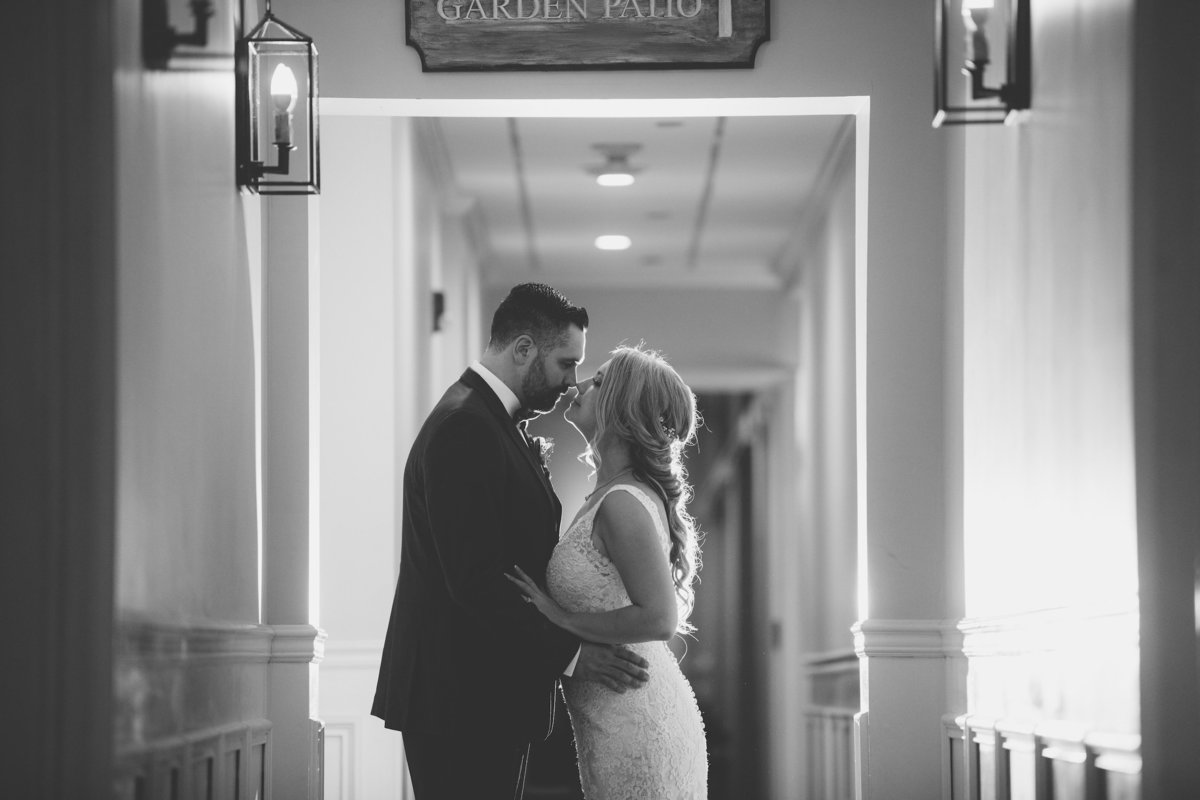 black and white photo of bride and groom in hallway from wedding at The Vineyards at Aquebogue