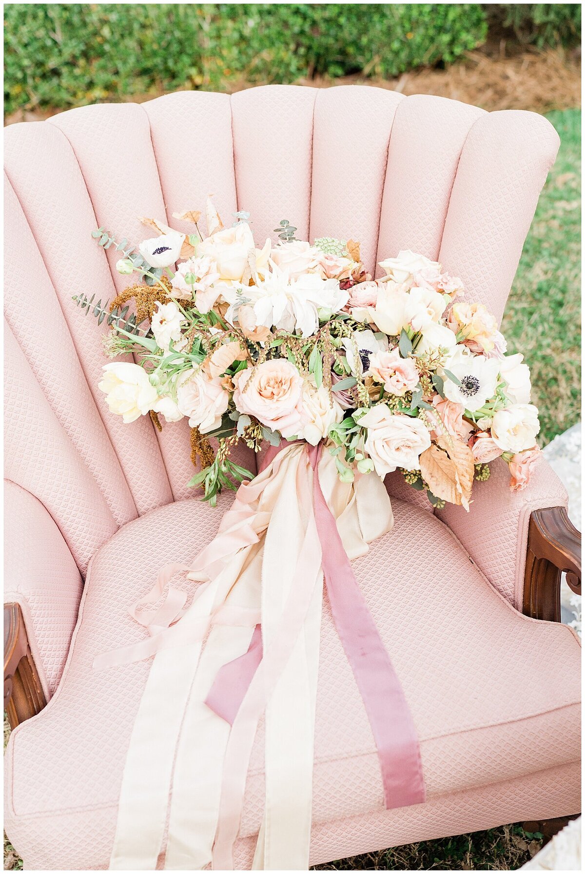 Pink chair with wedding bouquet of white flowers