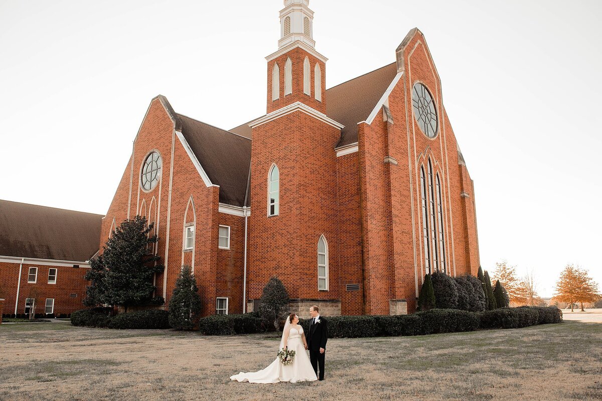 Newlyweds standing on the front lawn of First United Methodist in Murfreesboro