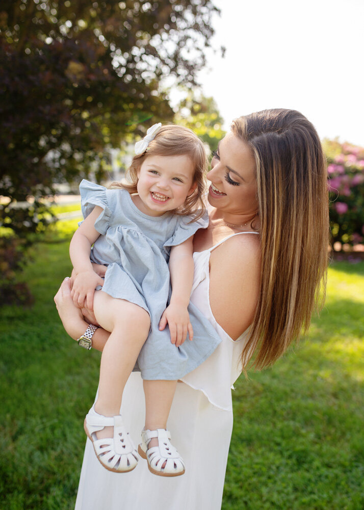 Family session of little girl in a blue dress