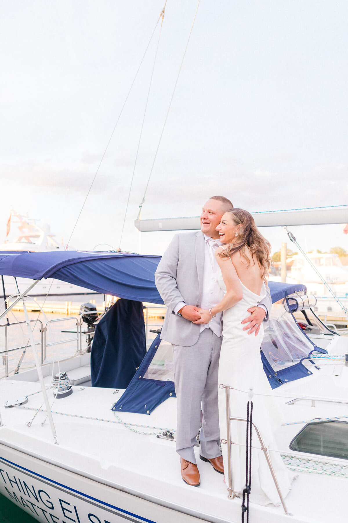 bohlin of newport wedding couple hugging on a boat