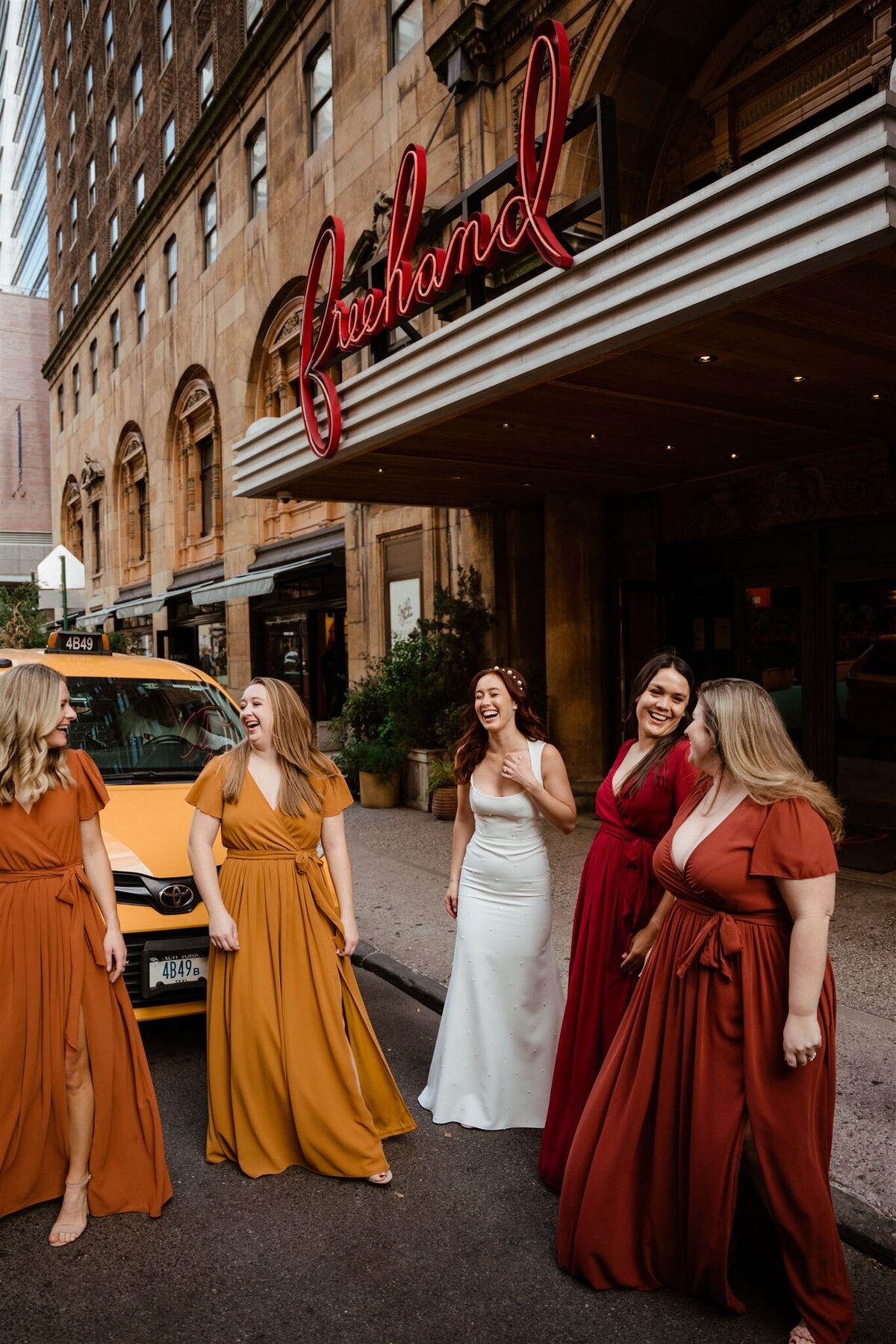 mismatched bridesmaids dresses during bridal party photos