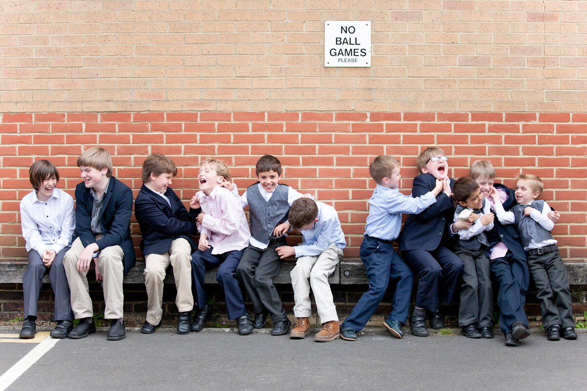 School kids laughing before wedding ceremony