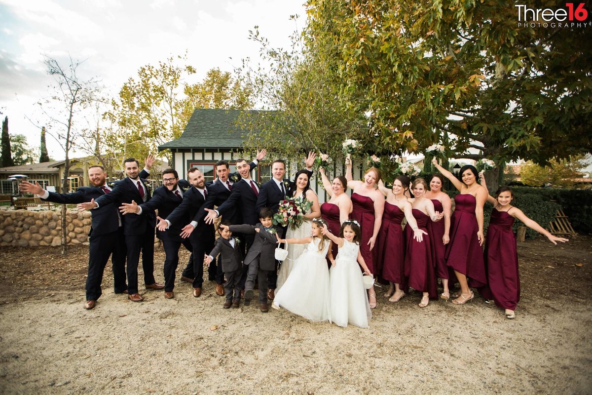 They Did It! Bride and Groom pose with their wedding party