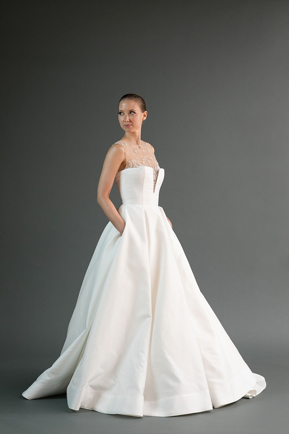 Kei is a modern ballgown wedding dress with pockets and an illusion neckline by indie bridal designer Edith Elan.