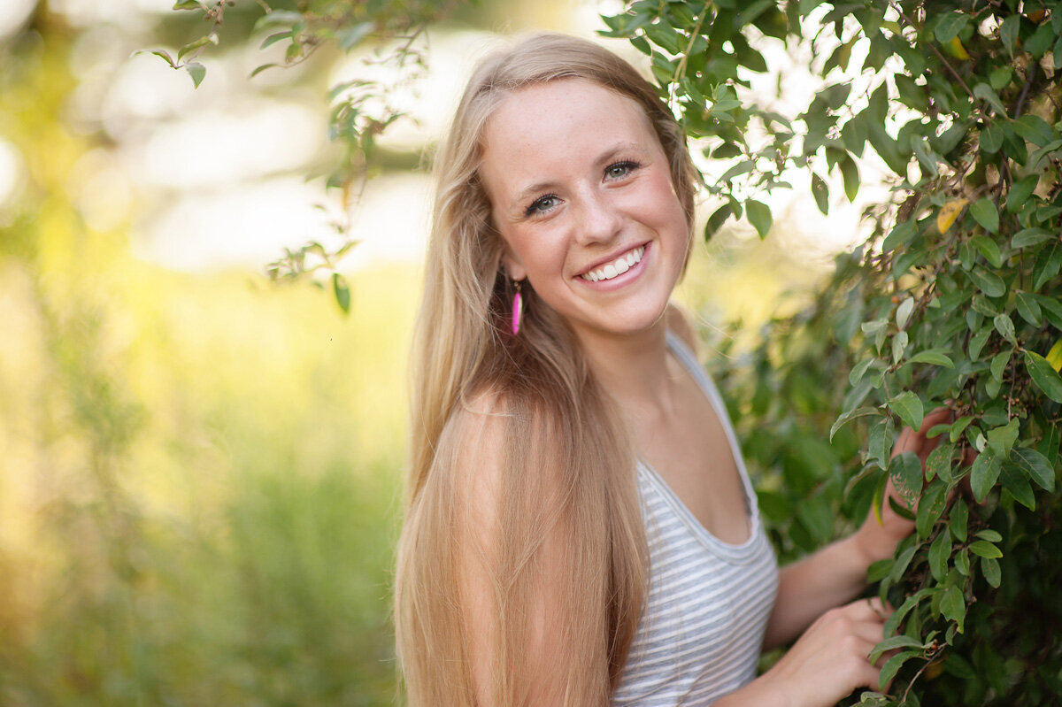 Young woman smiling during senior session