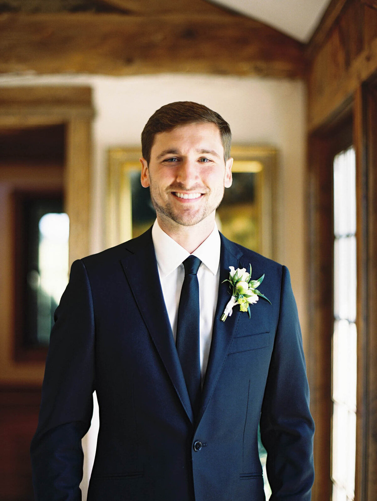 Color image of a groom on his wedding day morning at Goodstone Inn.