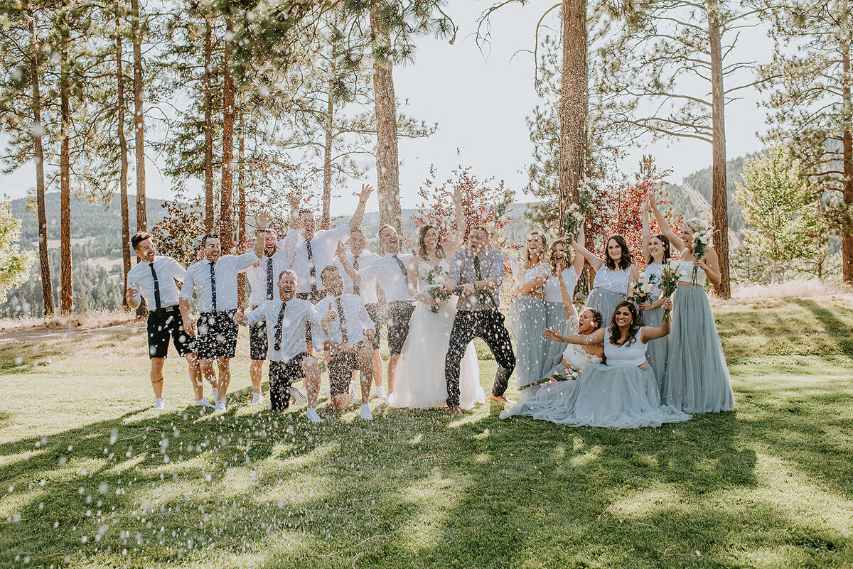 Bridal party popping champagne at a backyard wedding on the Sunshine Coast B.C