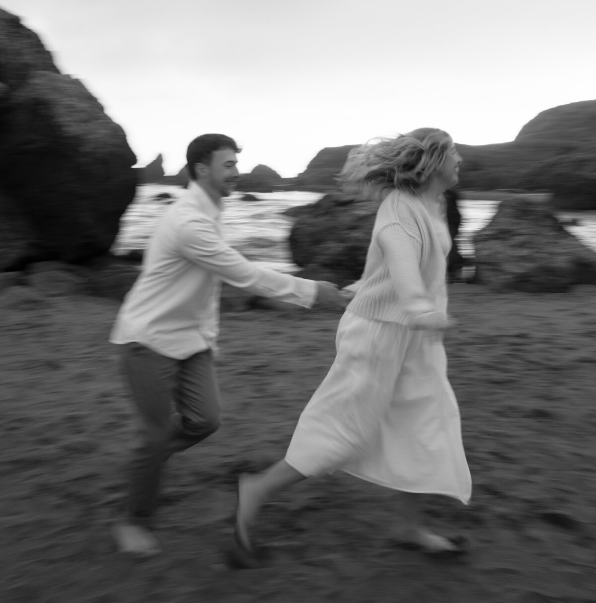 couple running secret beach oregon engagement photos