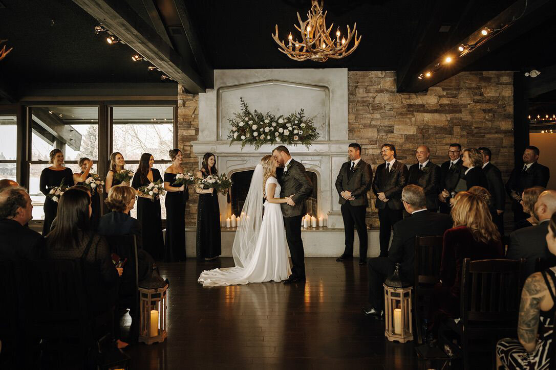 Moody and elegant indoor wedding ceremony planned by Fiore Fine Events, an elegant wedding planner based in Calgary, Alberta.  Featured on the Brontë Bride Vendor Guide.