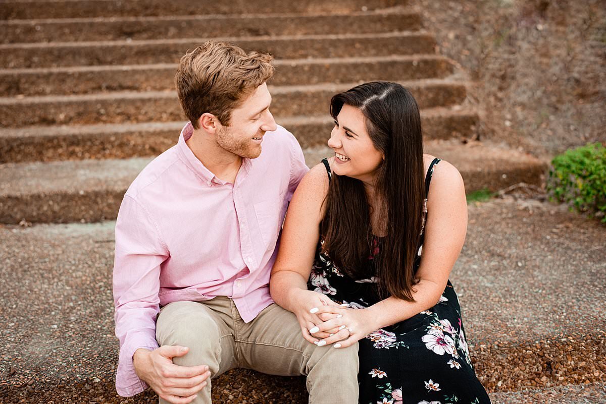 Couple sitting on steps laughing together