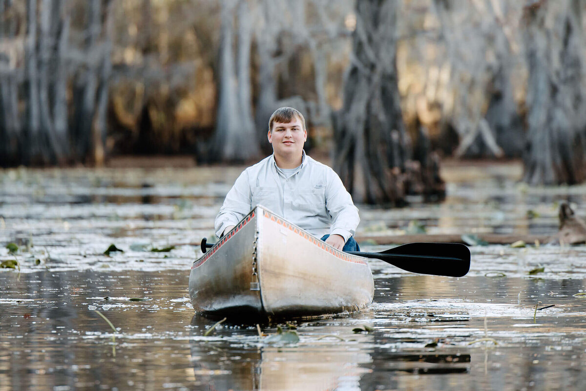 2024 Senior boy in canoe on Caddo Lake