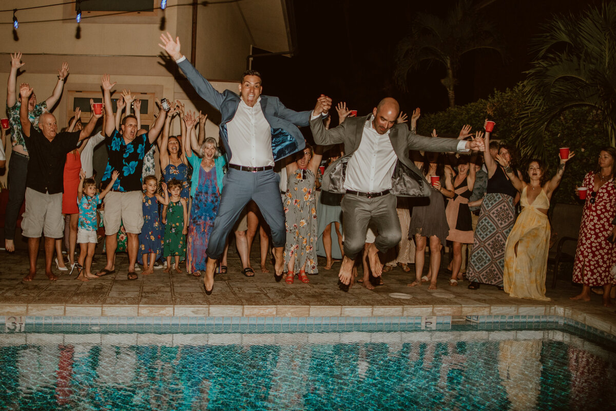 wedding in Wailea Maui Couple jumping into the pool