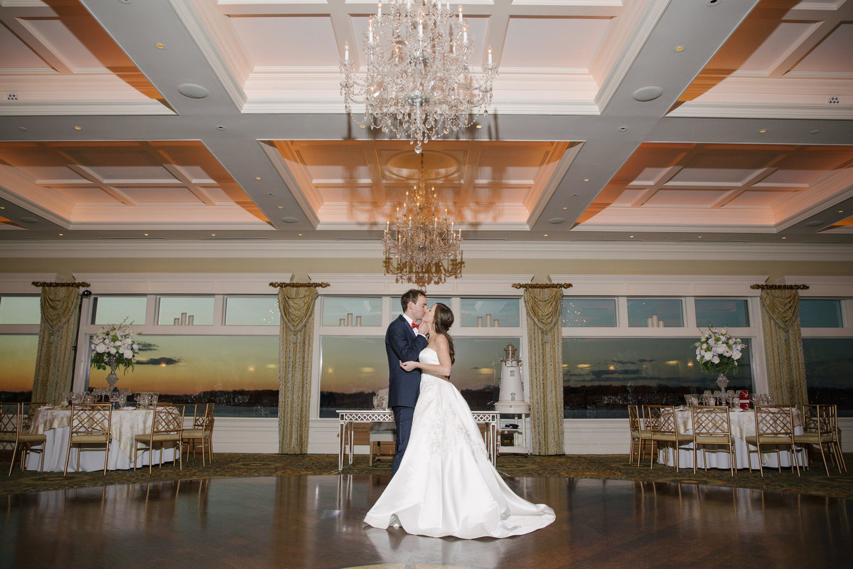 bride and groom in reception ballroom at clarks landing yacht club wedding