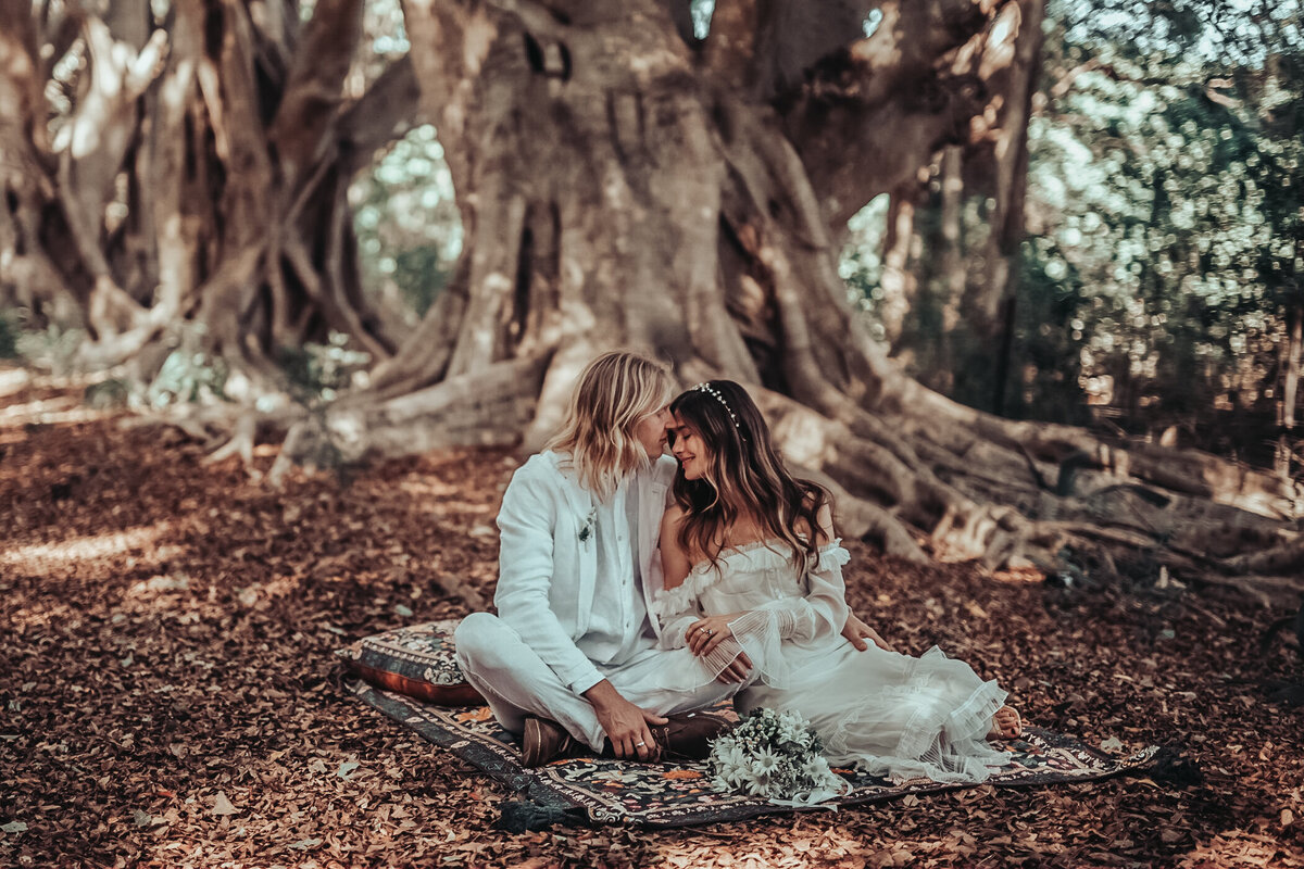 Elegant bride and groom in a jungle backdrop