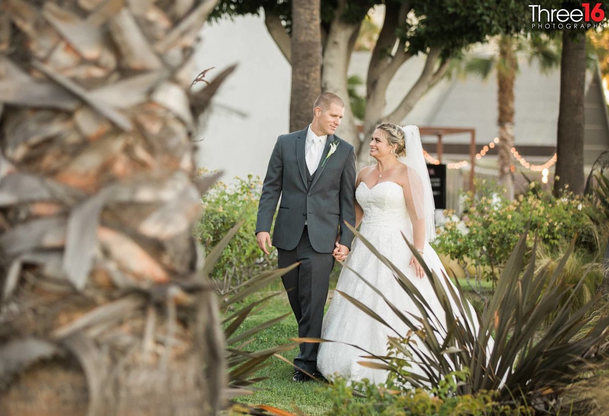 Bride and Groom go for a walk in the beautiful Hotel Maya landscape