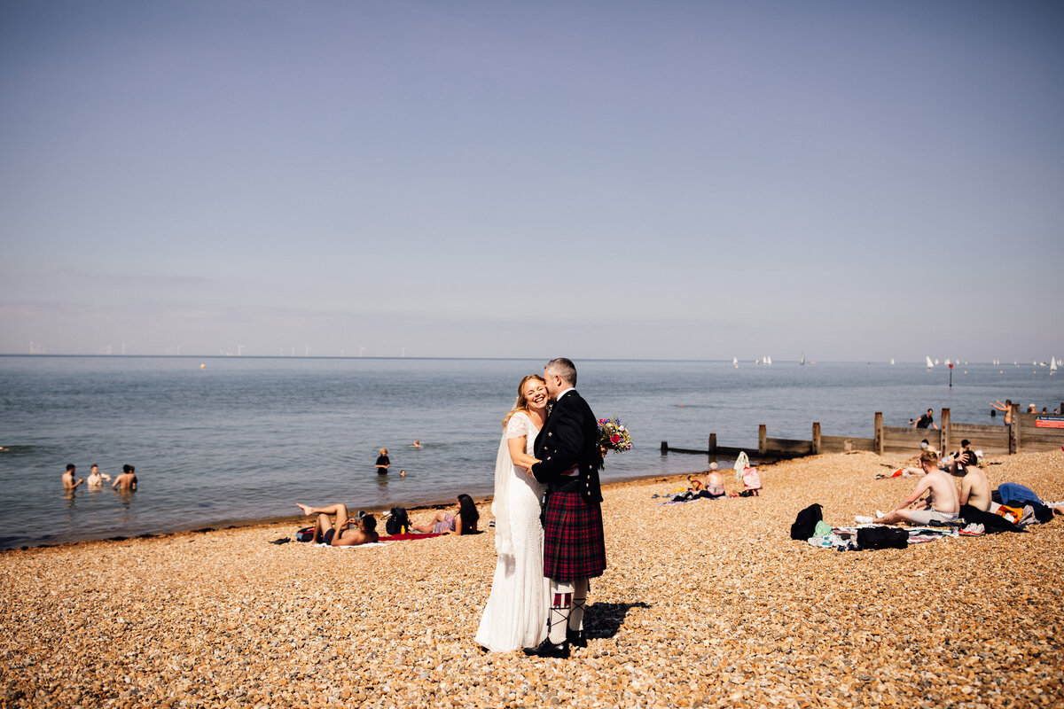 Bride and Groom on brighten beach