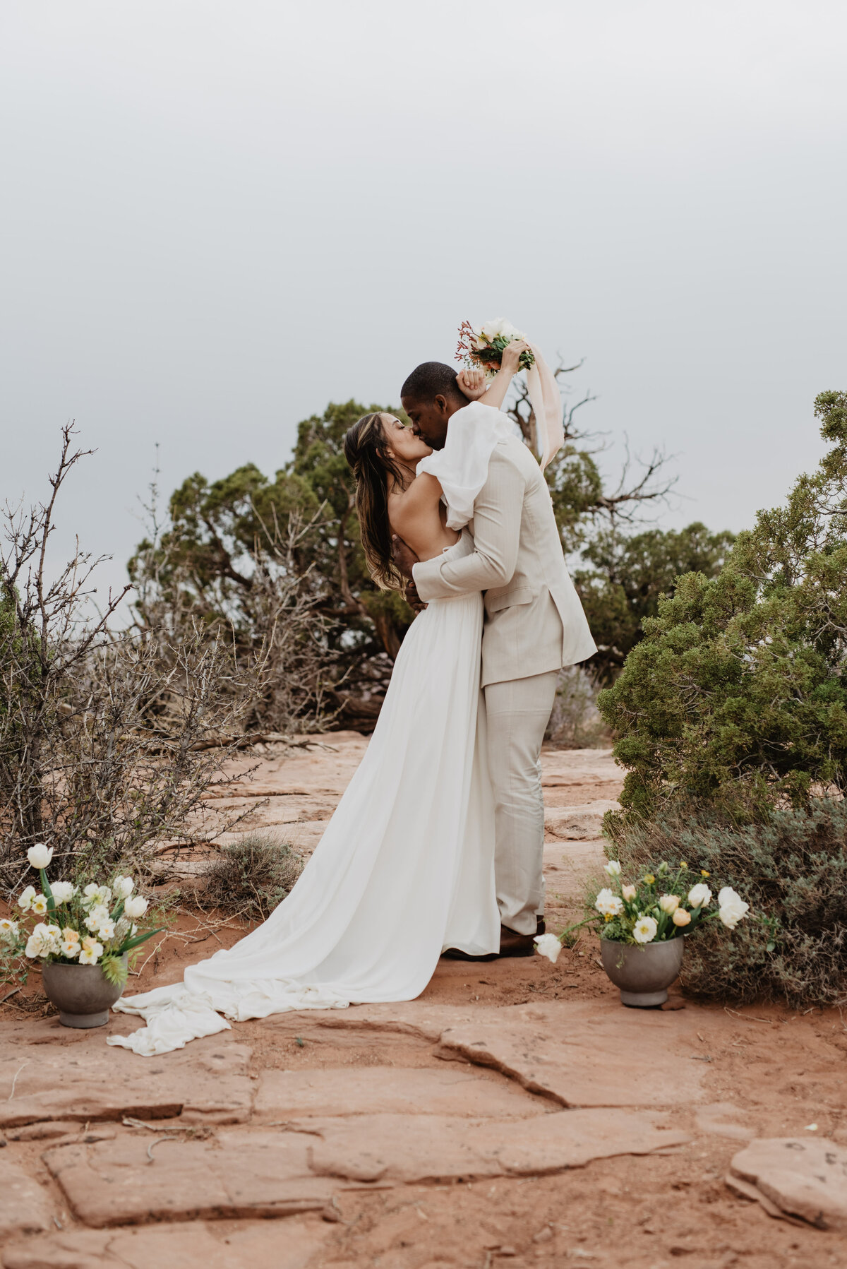 Utah Elopement Photographer captures couple kissing after ceremony as husband and wife