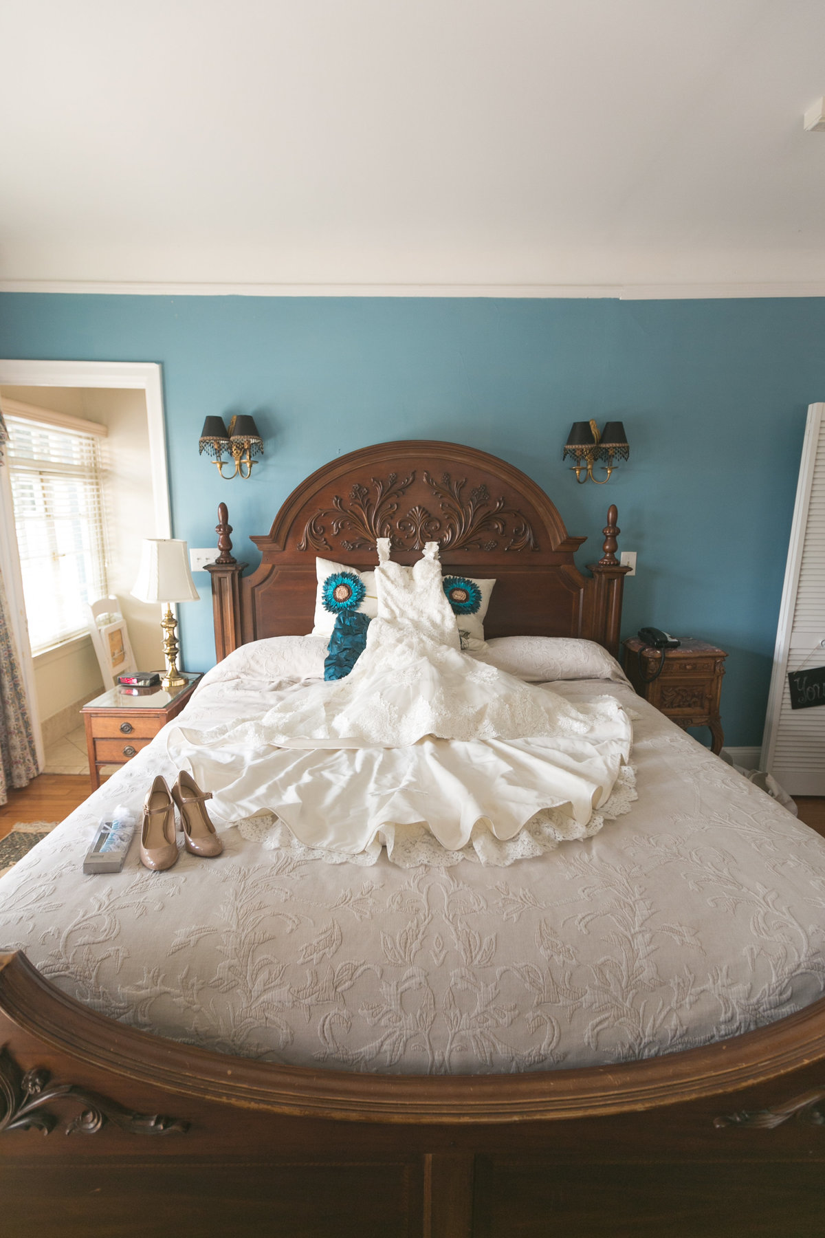 Wedding Dress and Shoes on a Bed Prior to Club Continental Wedding in Orange Park