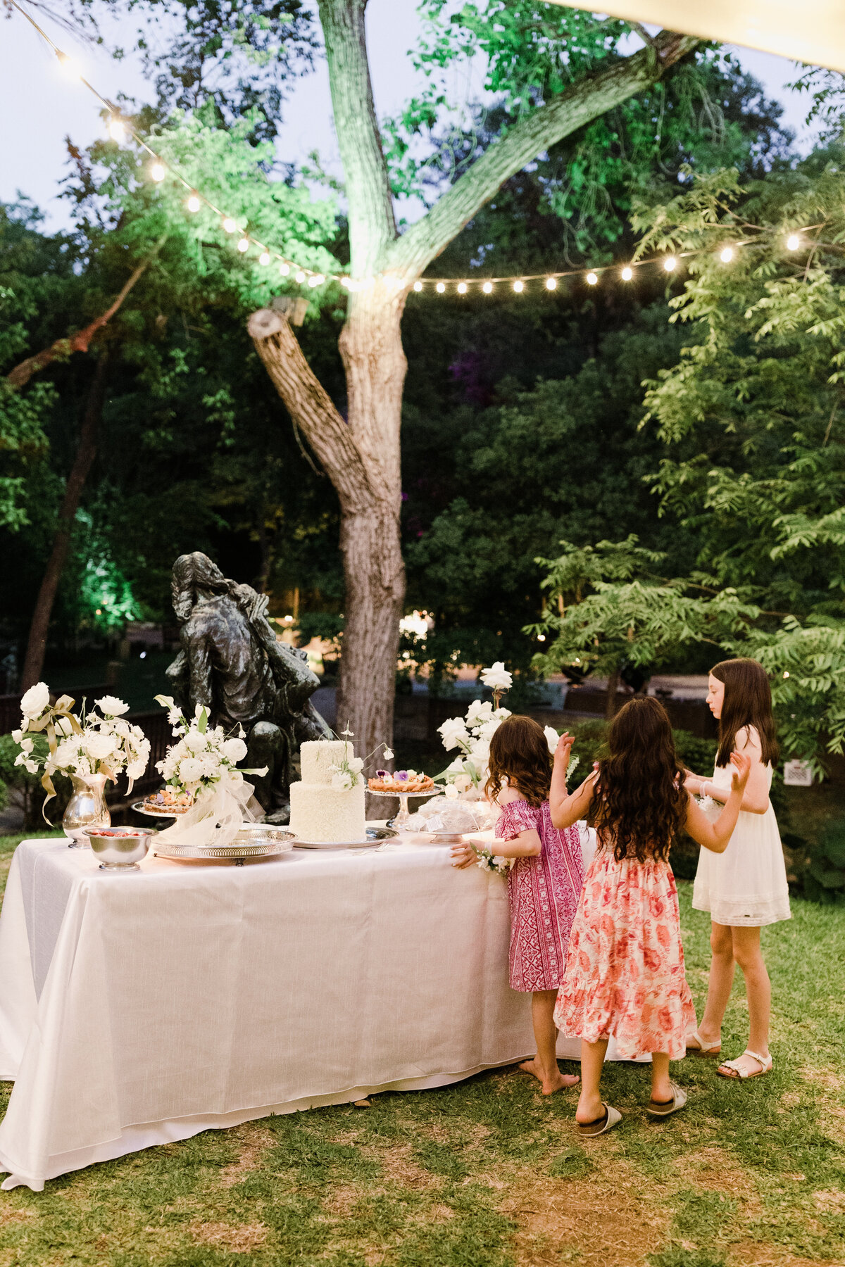 Guests at dessert table at Umlauf Sculpture Garden wedding, Austin