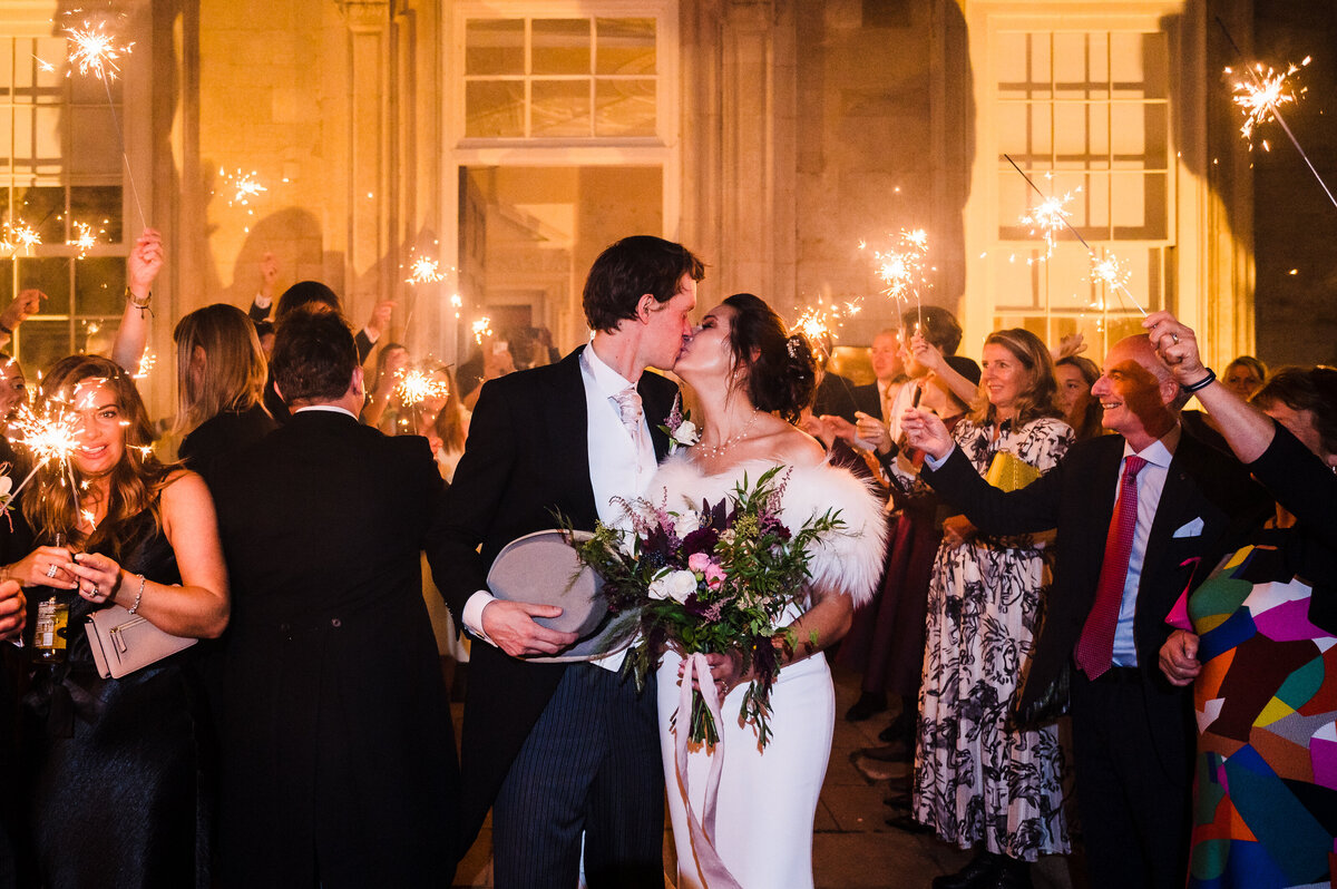 Couples exit through sparklers at Stapleford Park hotel