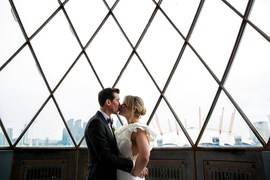 Cool photo of bride and groom in lighthouse.