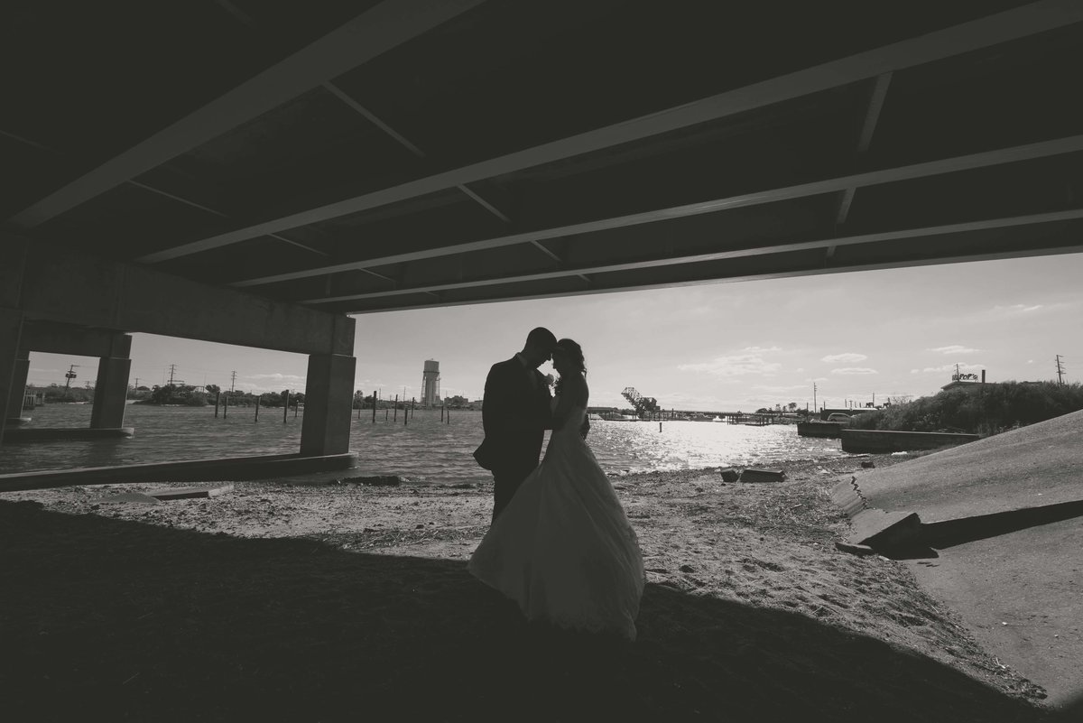 Black and white photo of a bride and groom at Bridgeview Yacht Club