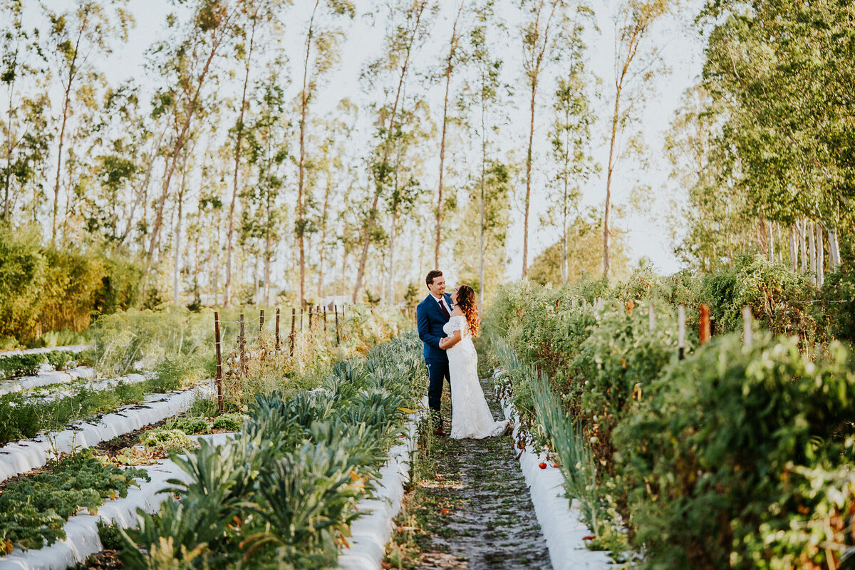 Newlywed bride and groom walk down the aisle at Ever After Farms Ranch wedding ceremony