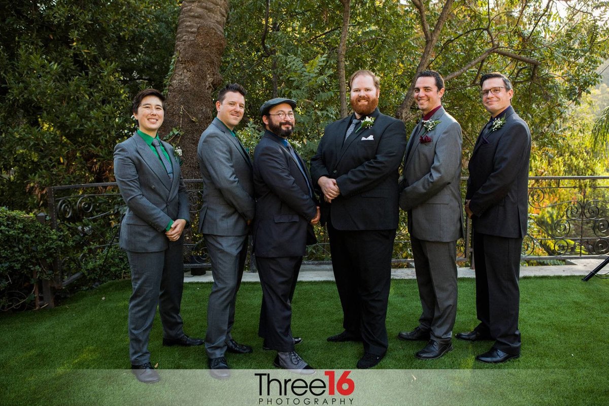 Groom and his Groomsmen pose for the photographer