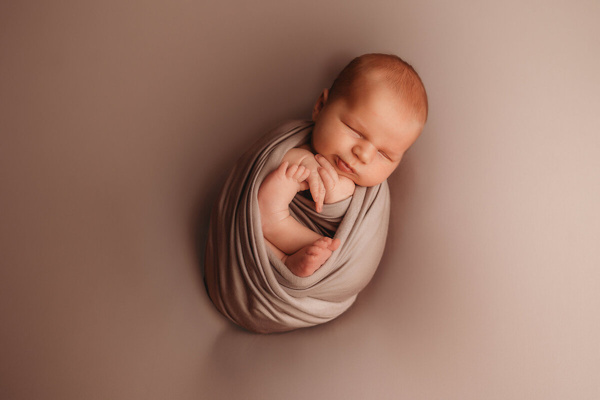Baby boy posed for Newborn Photoshoot in Asheville.