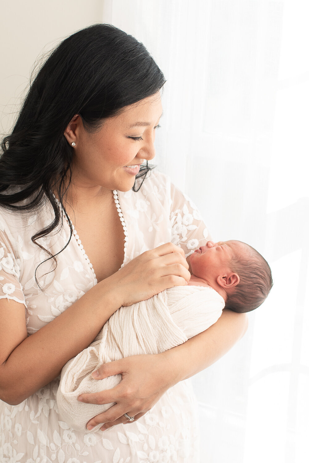Mother holding newborn baby boy at studio newborn session | Sharon Leger Photography | CT Newborn & Family Photographer | Canton, Connecticut