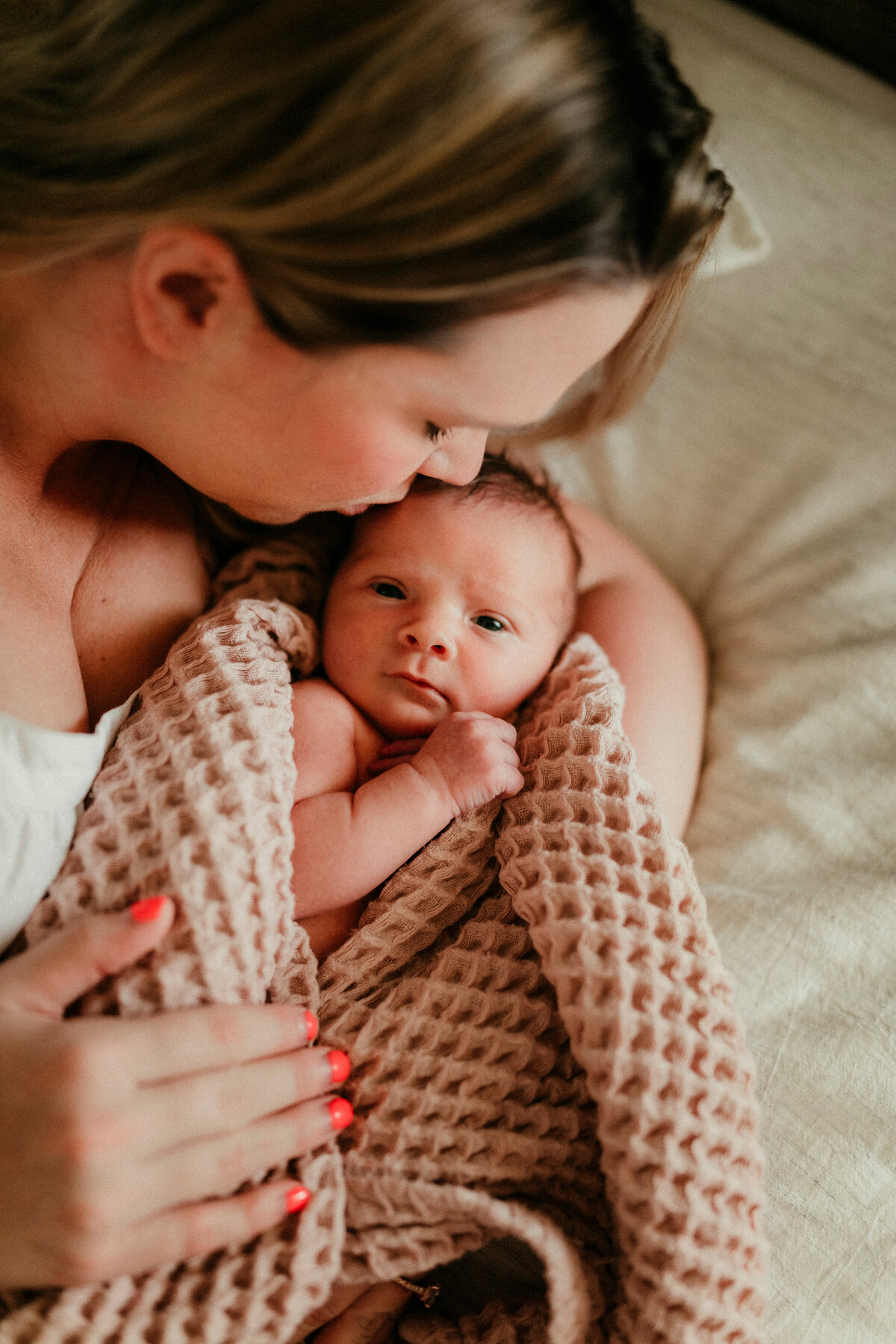 Discover dreamland harmony with St. Paul newborn photography at home. Shannon Kathleen Photography creates portraits that reflect the dreamy serenity of your newborn in your family space