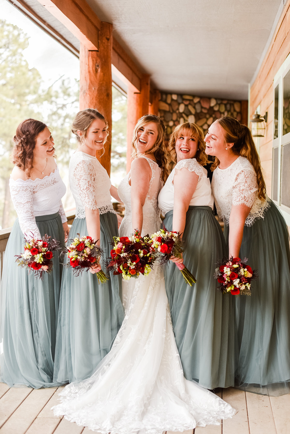 Bride with bridesmaids holding bouquets Mormon Lake Lodge Flagstaff  wedding