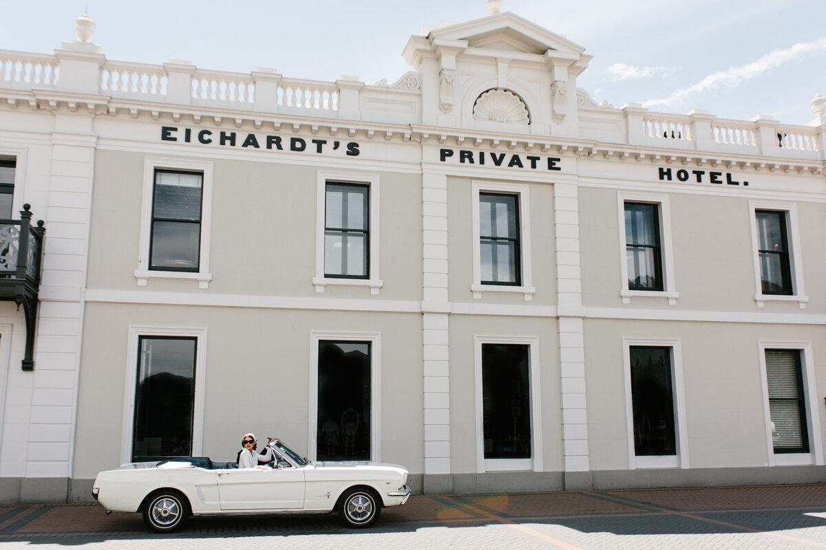 The Lovers Elopement Co - classic car in front of Eicharts Hotel Queenstown