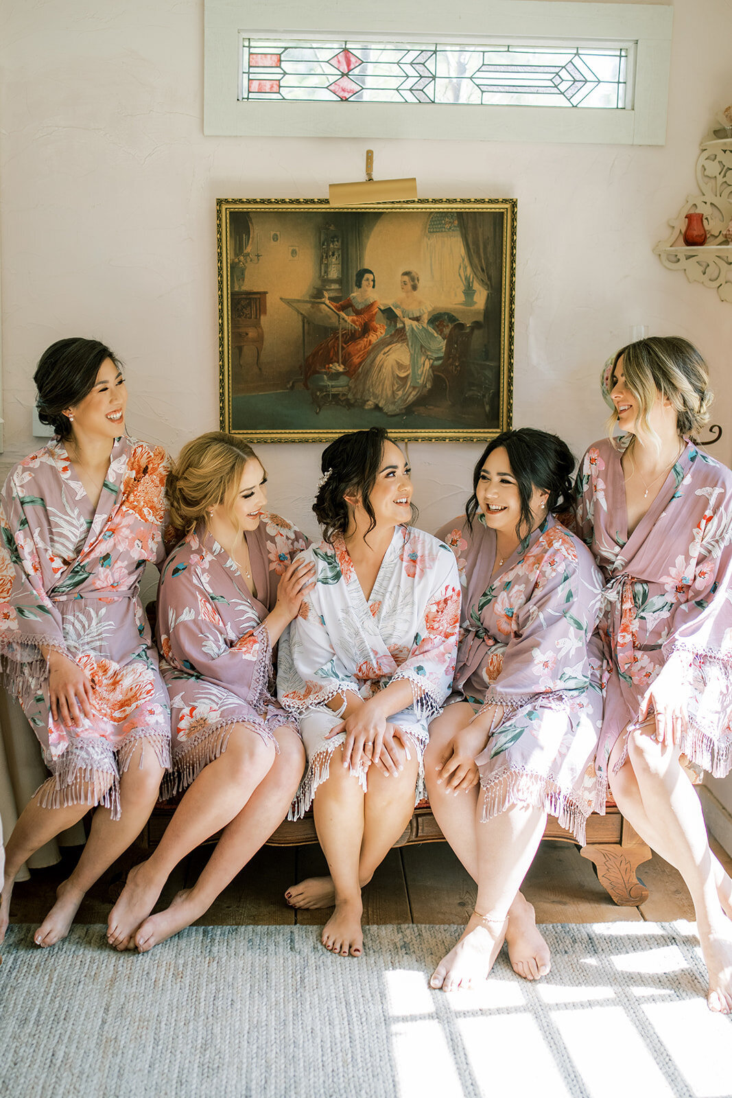 Bridesmaids getting ready in floral robes at Union Hill inn in Sonora CA