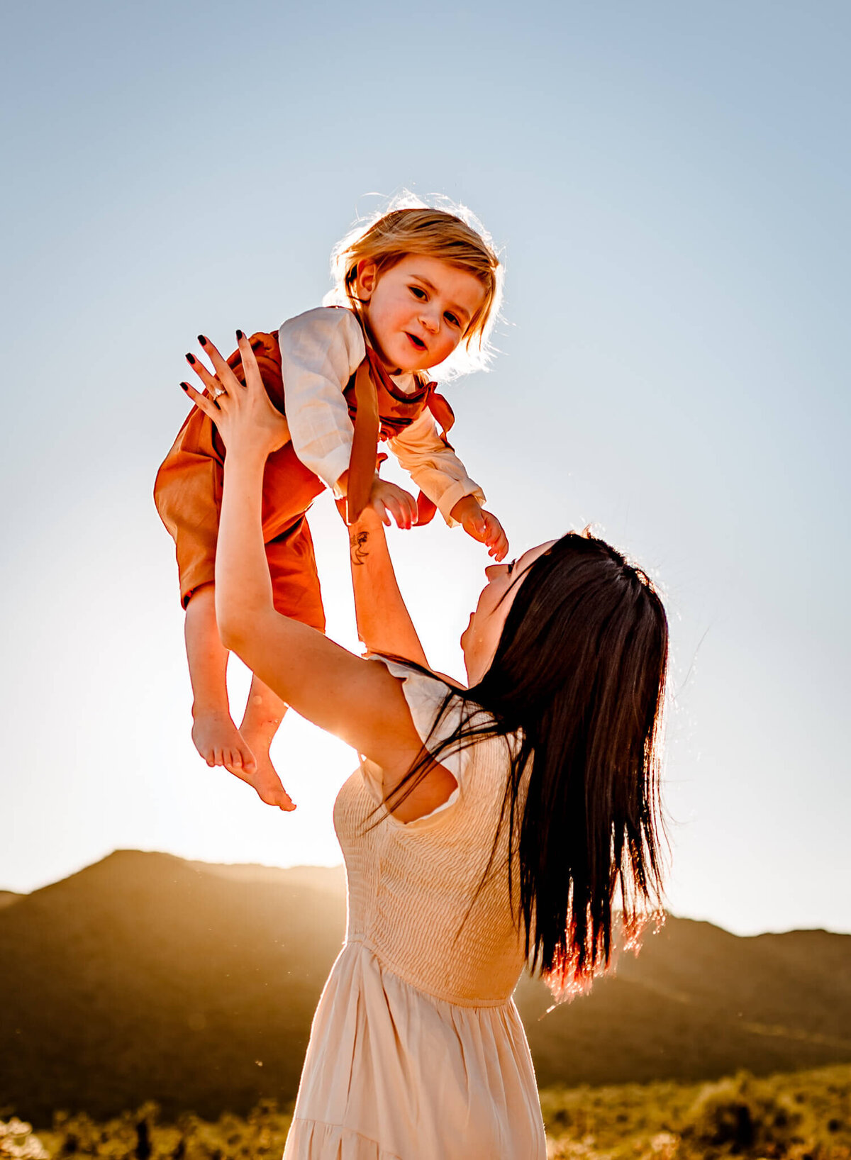 mom holding son up in AZ family photography session