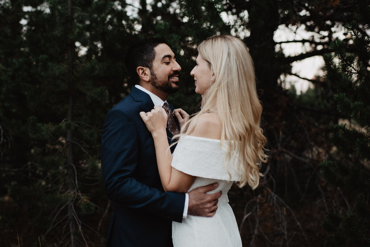 Photographers Jackson Hole capture bride holding groom's jacket