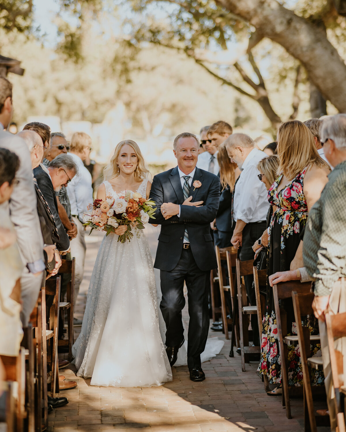 Bride and her father walking down the aisle on wedding day Temecula, California Wedding photographer Yescphotography