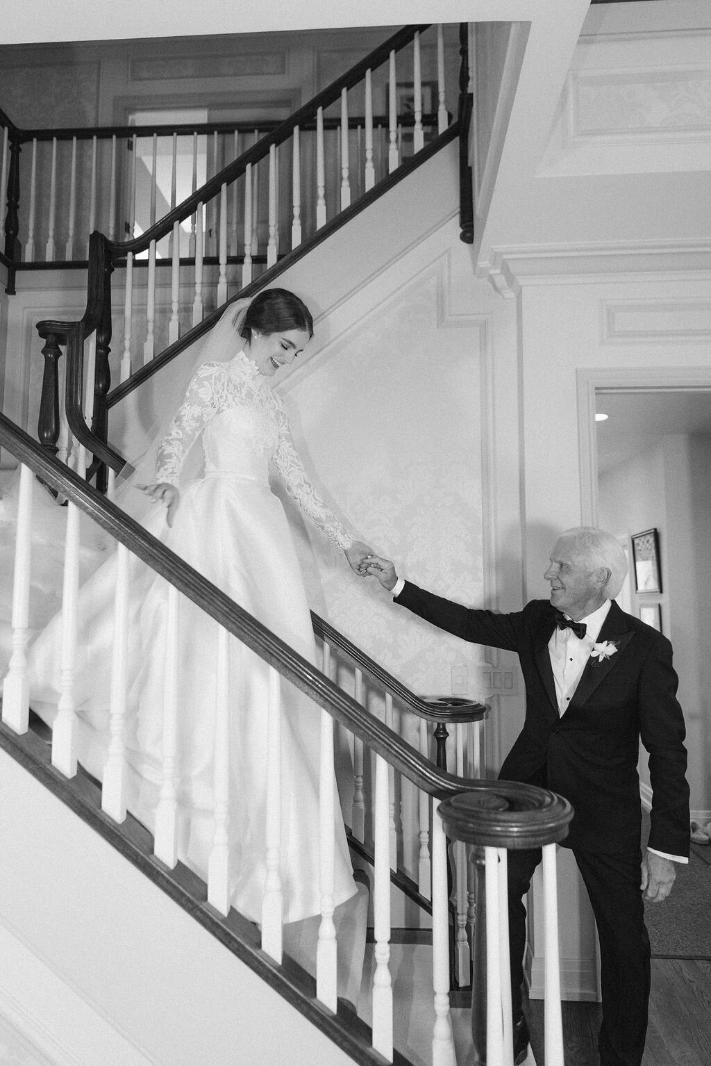 Bride coming down staircase
