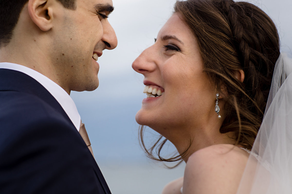 Portland Maine wedding the couple embrace and laugh after being married at the Eastern Promenade
