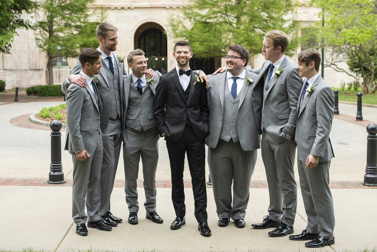 Groom and groomsmen laughing The Century Room Asheville, NC wedding photography