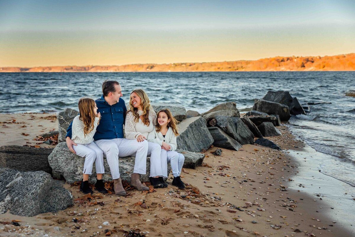 family on rocks at beach long island family photography