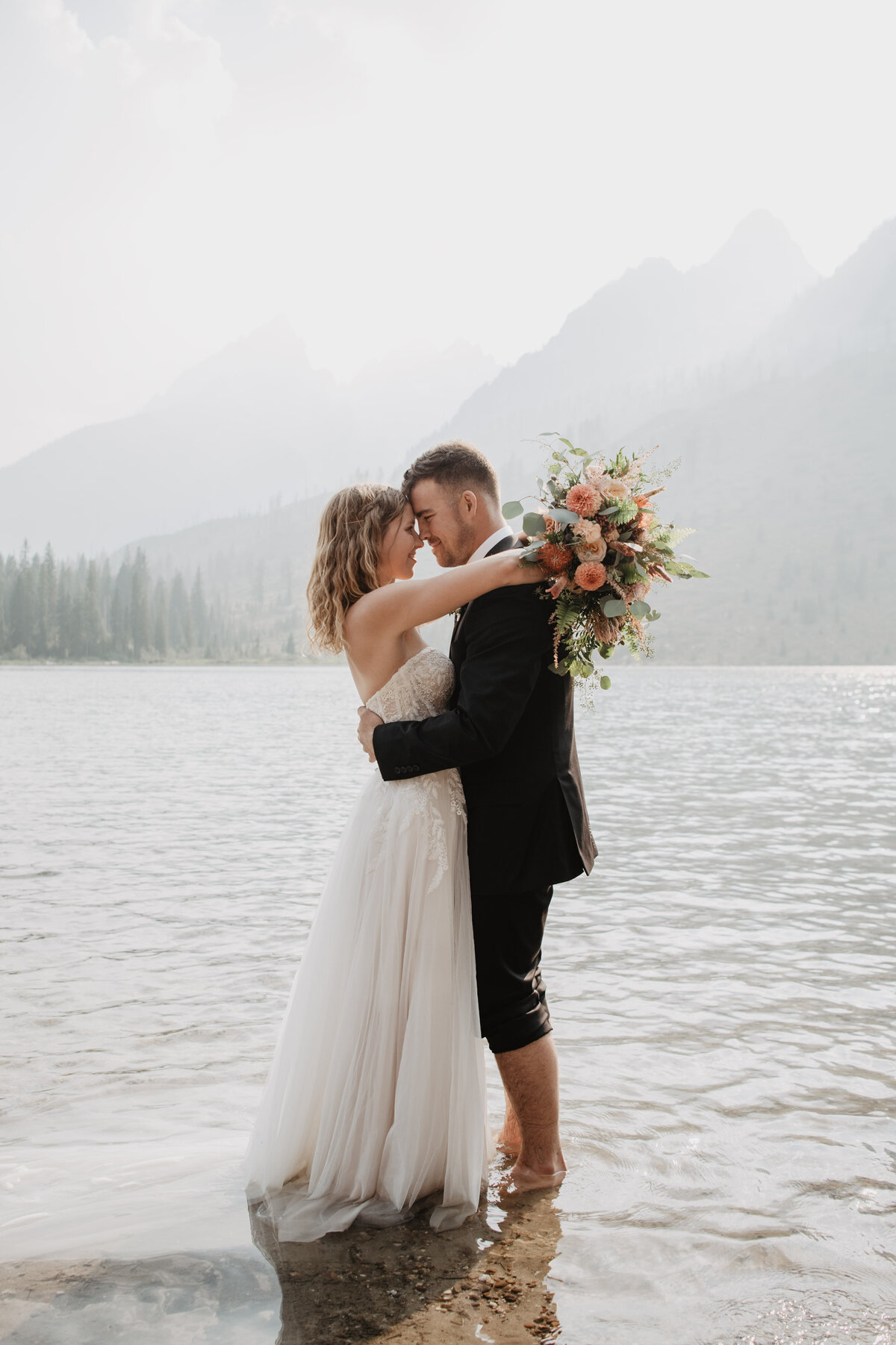 Jackson Hole Photographers capture couple embracing after Grand Teton elopement