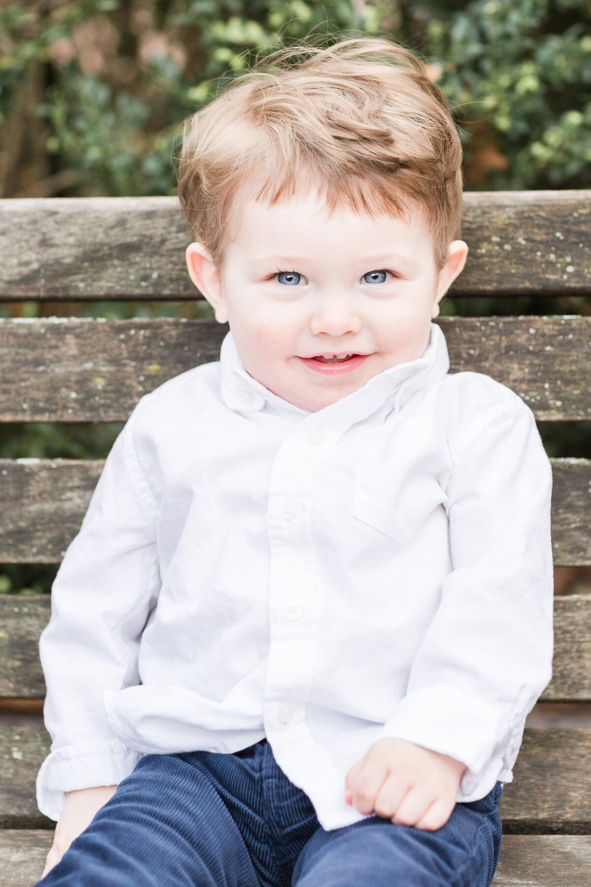 Boy with blue eyes smiling at camera
